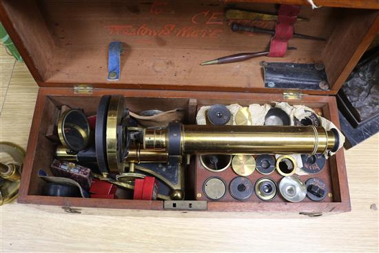 A Smith & Beck brass microscope, a bulls-eye condenser oil lamp, and a R & J Beck microscope microscope length 39cm